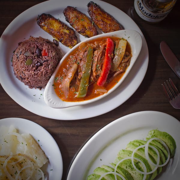 Rumba Cuban Cafe's Ropa Vieja with rice, plantains, yucca, and avocado salad.